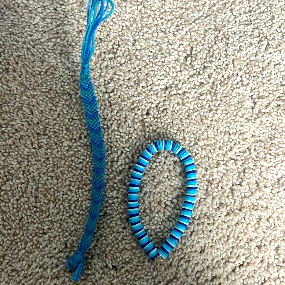 one chevron string bracelet and one matching blue clay bead bracelet